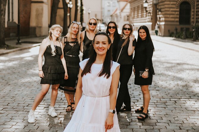 1H Private Photoshoot in Old Town of Riga - Stop 5: Laima Clock for a memorable finale