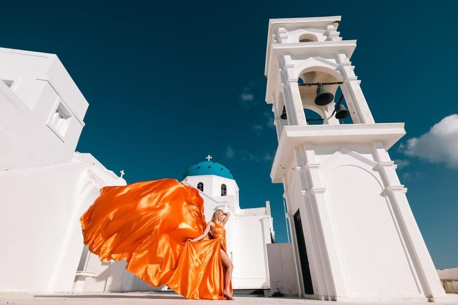 Flying dress Photoshoot in Santorini with Hotel Pickup - The Imerovigli Shoot: Blue Domes, White Walls, and Pose Guidance