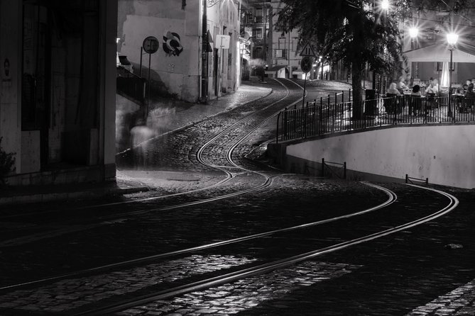 Lisbon by Night: Golden and Blue Hour Photography Walk - Miradouro das Portas do Sol: cobblestones, tram tracks, and light trails