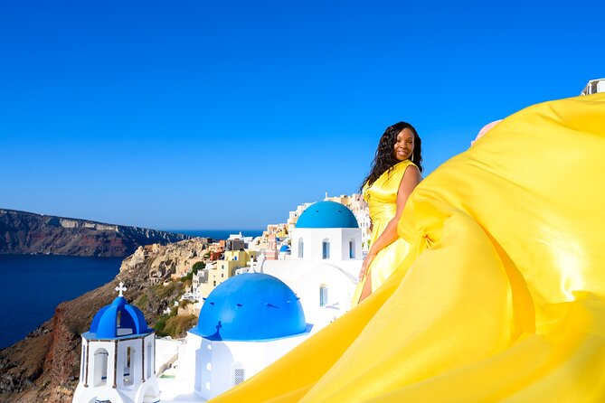 Santorini 2h Private Flying Dress Photoshoot with Transportation - Stop 1: Oia blue-domes, big icons, and morning-light caution