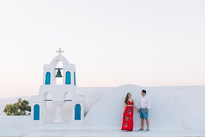 Santorini - Private Photoshoot with a Top Local Photographer - Stop 1: Three Bells of Fira and the Classic Santorini Streets Look